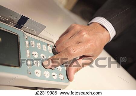 Stock Photography - Finger pushing a button. Fotosearch