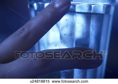 Stock Photography - Fingers holding a Glass. Fotosearch