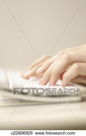 Stock Photo - Fingers typing on keyboard. Fotosearch