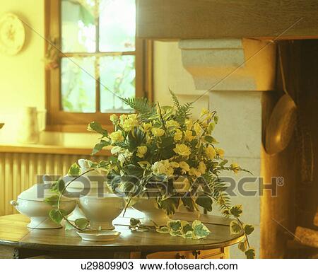 Stock Image - Flower arrangement in a kitchen. Fotosearch