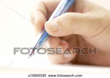 Stock Image - Hand holding Pen. Fotosearch