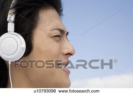 Stock Photo - Man listening to music. Fotosearch