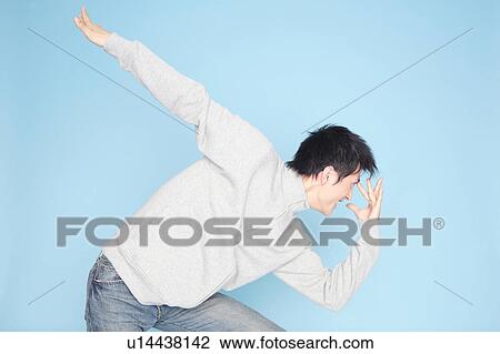 Stock Image - Man posing strange. Fotosearch
