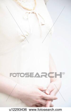 Stock Photograph - Mid section of woman. Fotosearch