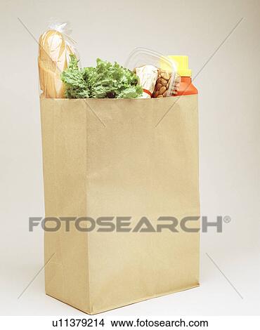 Paper bag filled with groceries View Large Photo Image Picture - Paper bag filled with groceries. Fotosearch