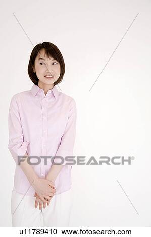 Stock Image - Portrait of curious young woman. Fotosearch