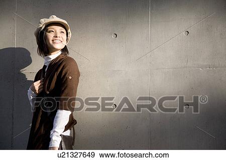 Stock Photo - Portrait of happy young woman. Fotosearch