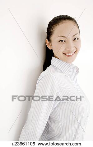 Stock Photography - Portrait of smiling young woman. Fotosearch