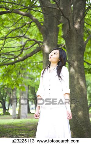 Stock Image - Portrait of woman outdoors. Fotosearch