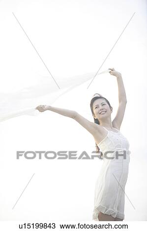 Portrait of woman outside wearing a dress View Large Photo Image Stock Image - Portrait of woman outside wearing a dress. Fotosearch