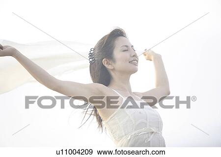 Portrait of woman wearing a dress View Large Photo Image Stock Photo - Portrait of woman wearing a dress. Fotosearch