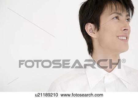 Portrait of young man looking up View Large Photo Image Stock Image - Portrait of young man looking up. Fotosearch