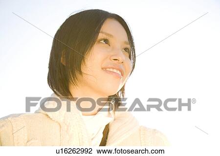 Stock Image - Portrait of young woman. Fotosearch