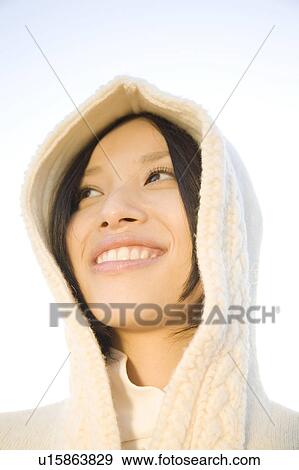 Portrait of young woman with hood up View Large Photo Image Stock Photo - Portrait of young woman with hood up. Fotosearch