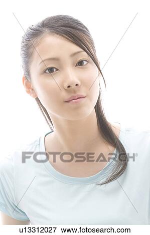 Portrait of young woman with serious expression View Large Photo Image Stock Photo - Portrait of young woman with serious expression. Fotosearch