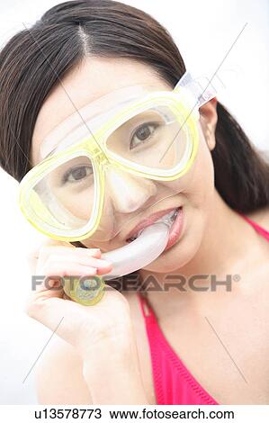 Portrait of young woman with snorkel at the beach View Large Photo Image Stock Image - Portrait of young woman with snorkel at the beach. Fotosearch