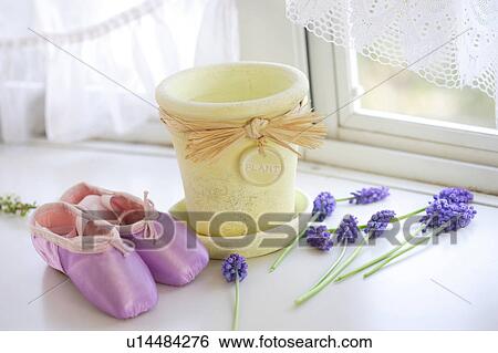 Stock Photograph - Pot, slippers, and flowers. Fotosearch