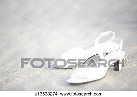 Sandals left on a beach View Large Photo Image Picture - Sandals left on a beach. Fotosearch