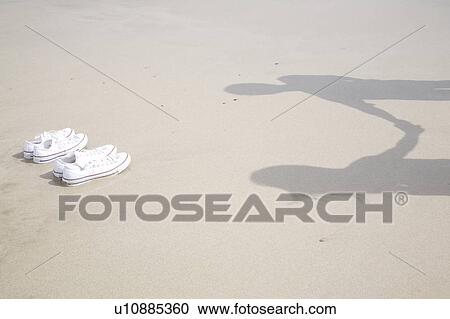 Shadows on a beach View Large Photo Image Stock Image - Shadows on a beach. Fotosearch