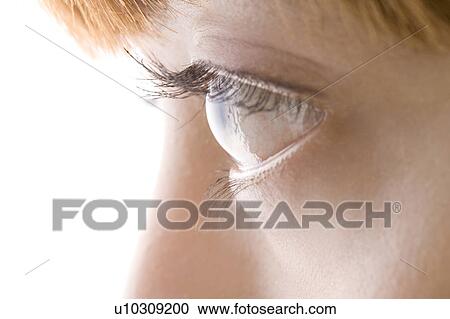 Stock Image - Side view close-up of eye and lashes. Fotosearch