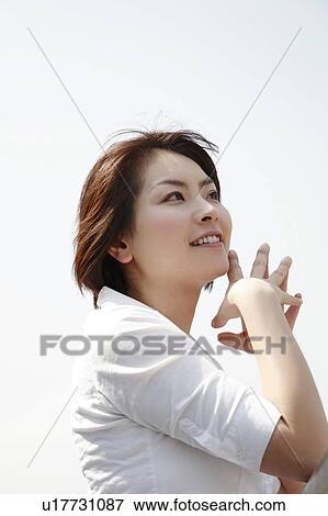 Side view of young woman View Large Photo Image Stock Photo - Side view of young woman. Fotosearch