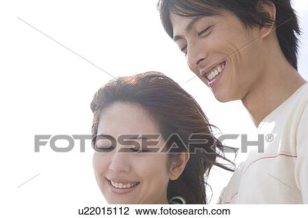 Smiling young couple View Large Photo Image Stock Image - Smiling young couple. Fotosearch