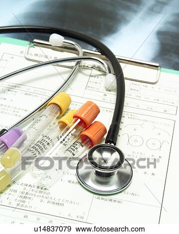 Stock Photo - Stethoscope, x-ray, medical chart and vials. Fotosearch