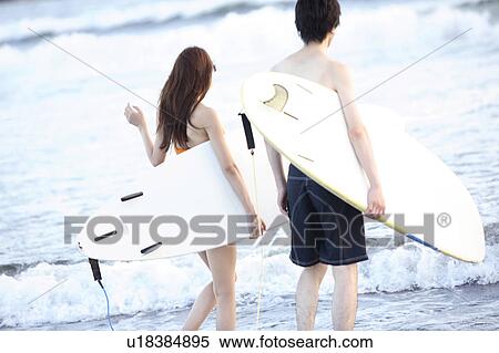 Stock Photography - Surfers at Enoshima beach. Fotosearch