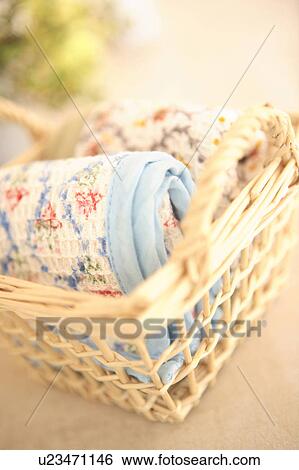 Stock Photograph - Towel in a basket. Fotosearch