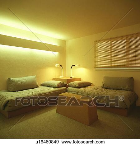 Stock Photo - Two small beds in a bedroom. Fotosearch