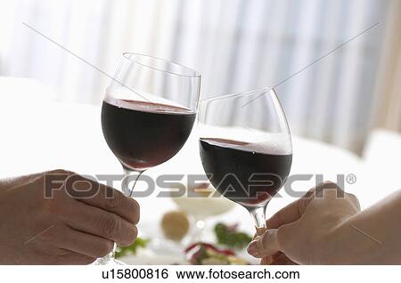 Wine toasting View Large Photo Image Stock Photograph - Wine toasting. Fotosearch