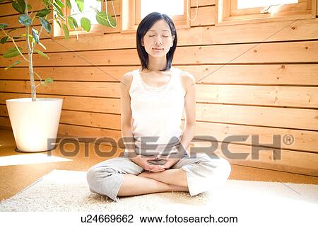 Stock Image - Woman doing exercise. Fotosearch