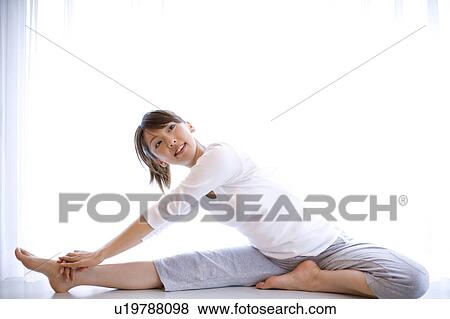 Stock Photo - Woman doing exercise. Fotosearch