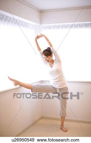 Stock Photo - Woman doing exercise. Fotosearch