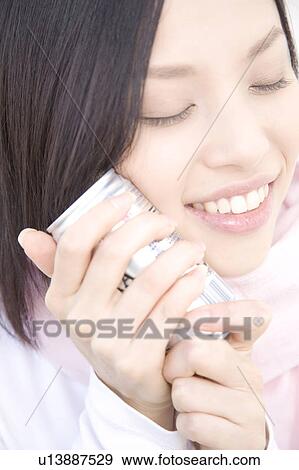 Stock Photo - Woman gripping a can of coffee. Fotosearch