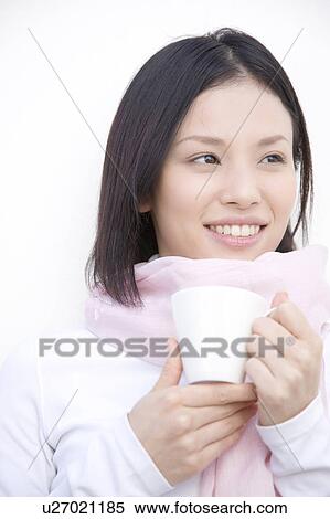Woman gripping a coffee cup View Large Photo Image Stock Photography - Woman gripping a coffee cup. Fotosearch