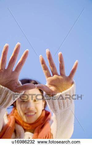 Stock Image - Woman in scarf and sweater. Fotosearch