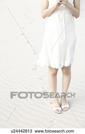 Stock Image - Woman on the beach. Fotosearch