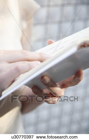 Stock Photo - Woman reading book. Fotosearch