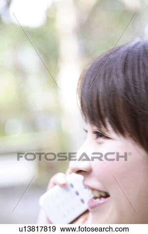 Woman talking on cell phone View Large Photo Image Stock Photo - Woman talking on cell phone. Fotosearch