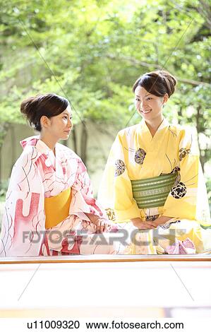 Women putting on a yukata View Large Photo Image Stock Image - Women putting on a yukata. Fotosearch