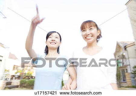 Women taking a walk View Large Photo Image Stock Image - Women taking a walk. Fotosearch