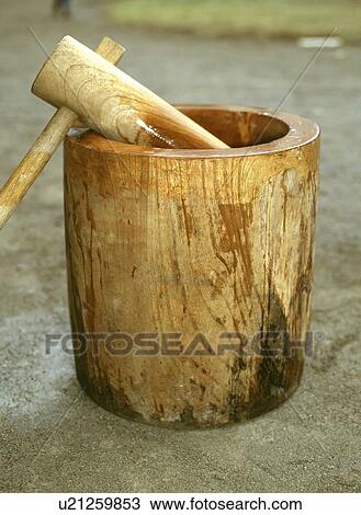 Stock Image - Wooden mortar and mallet. Fotosearch