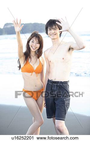 Stock Image - Young couple in Enoshima. Fotosearch