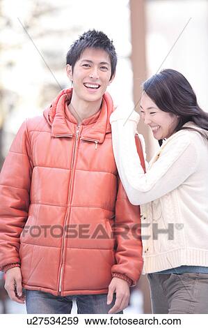 Young couple wearing jackets View Large Photo Image Stock Photo - Young couple wearing jackets. Fotosearch