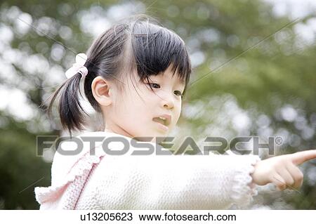 Young girl pointing View Large Photo Image Stock Image - Young girl pointing. Fotosearch