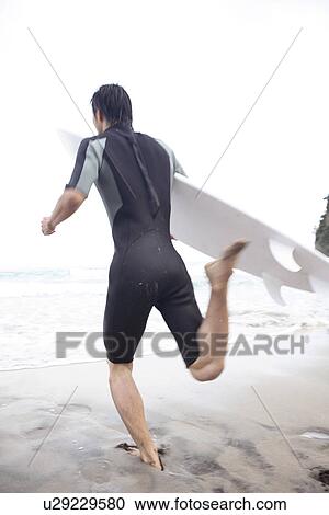 Young Japanese surfer View Large Photo Image Stock Image - Young Japanese surfer. Fotosearch