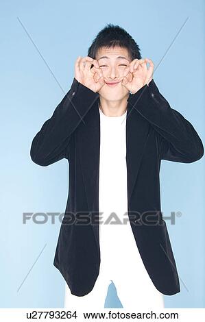 Picture - Young man making a face. Fotosearch