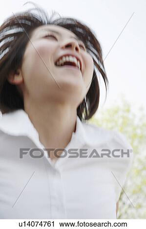 Young woman laughing View Large Photo Image Stock Image - Young woman laughing. Fotosearch
