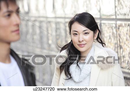 Young woman looking at young man View Large Photo Image Stock Image - Young woman looking at young man. Fotosearch